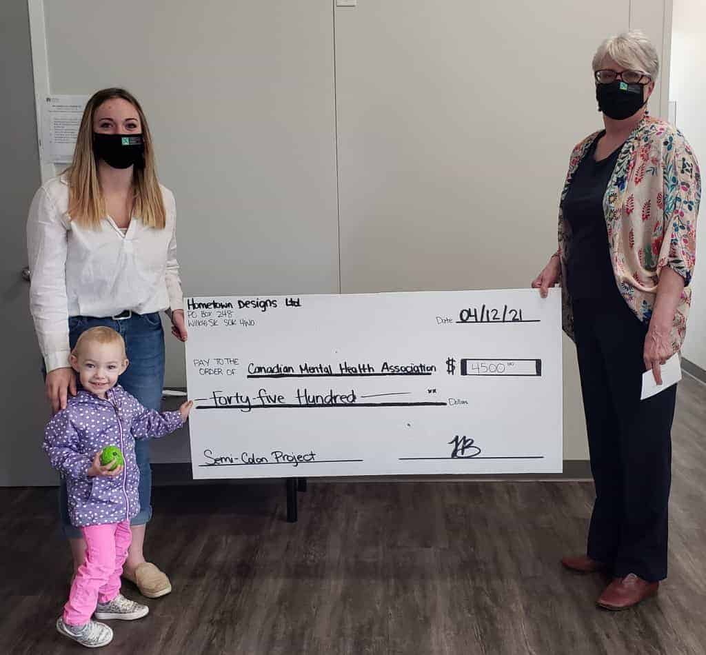 Fundraising Toni Bryan and Spencer photo with cheque